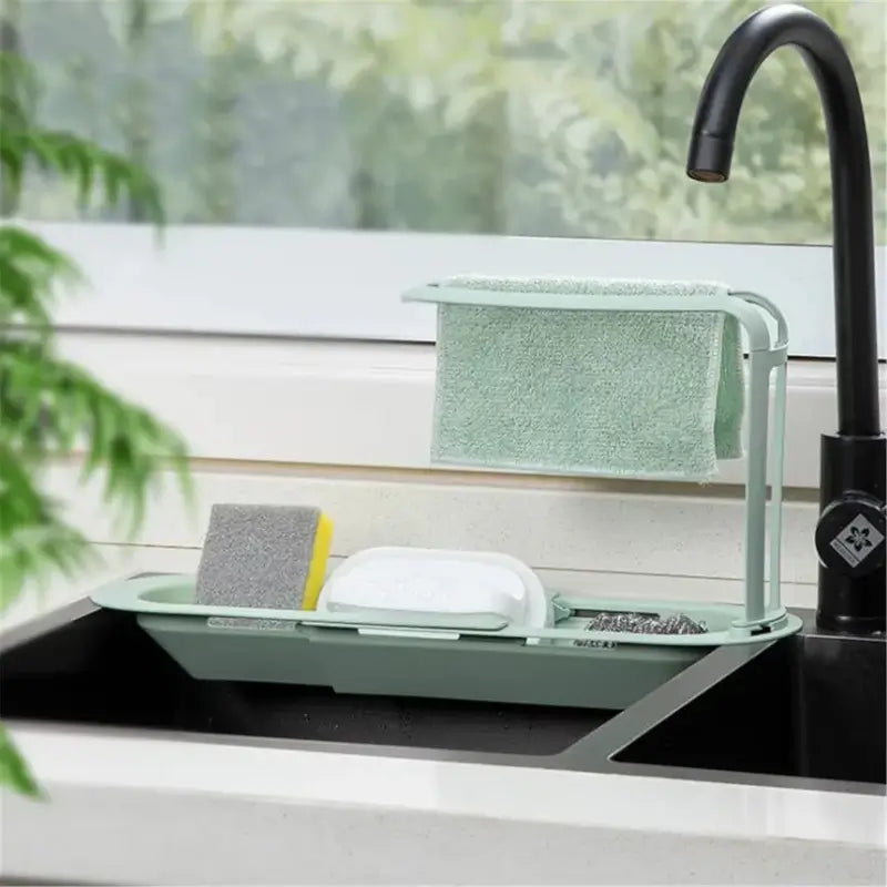 Adjustable kitchen sink organizer for sponges and scrubbers