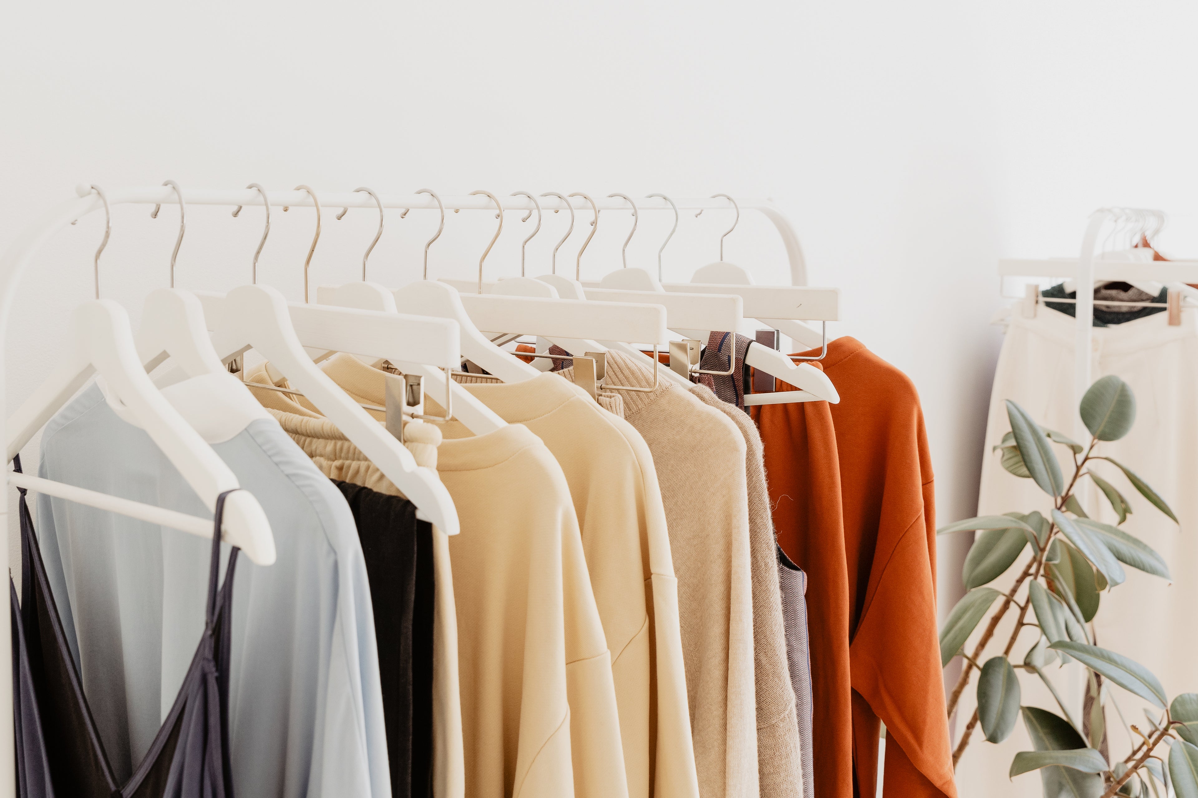 Modern women’s fashion dresses on hangers at Cozyecom store